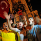 Supporters of Turkey’s President Erdogan, protest in front of soldiers in Istanbul’s Taksim square (AP/Emrah Gurel).